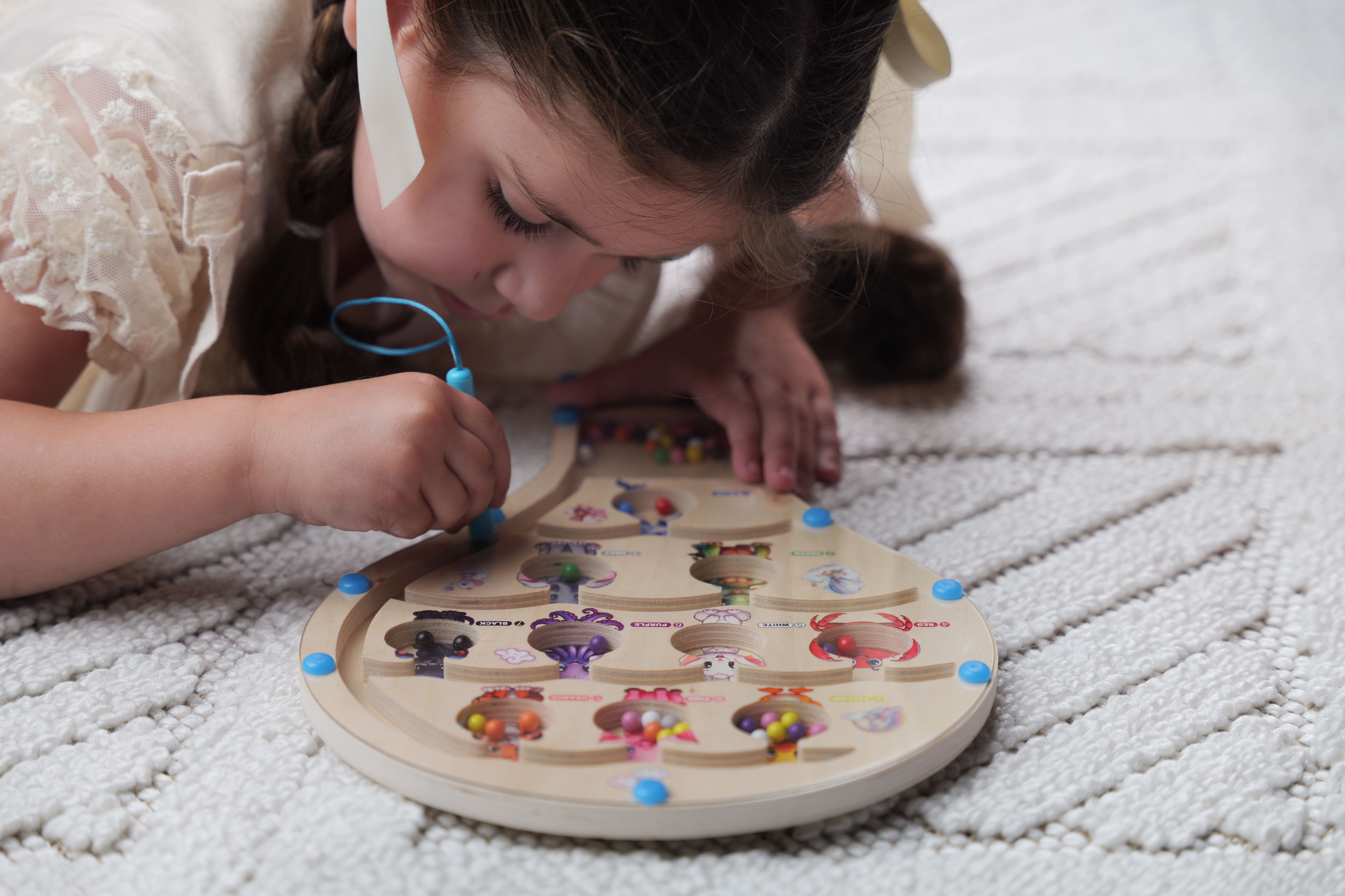 Child playing with My Agape toy